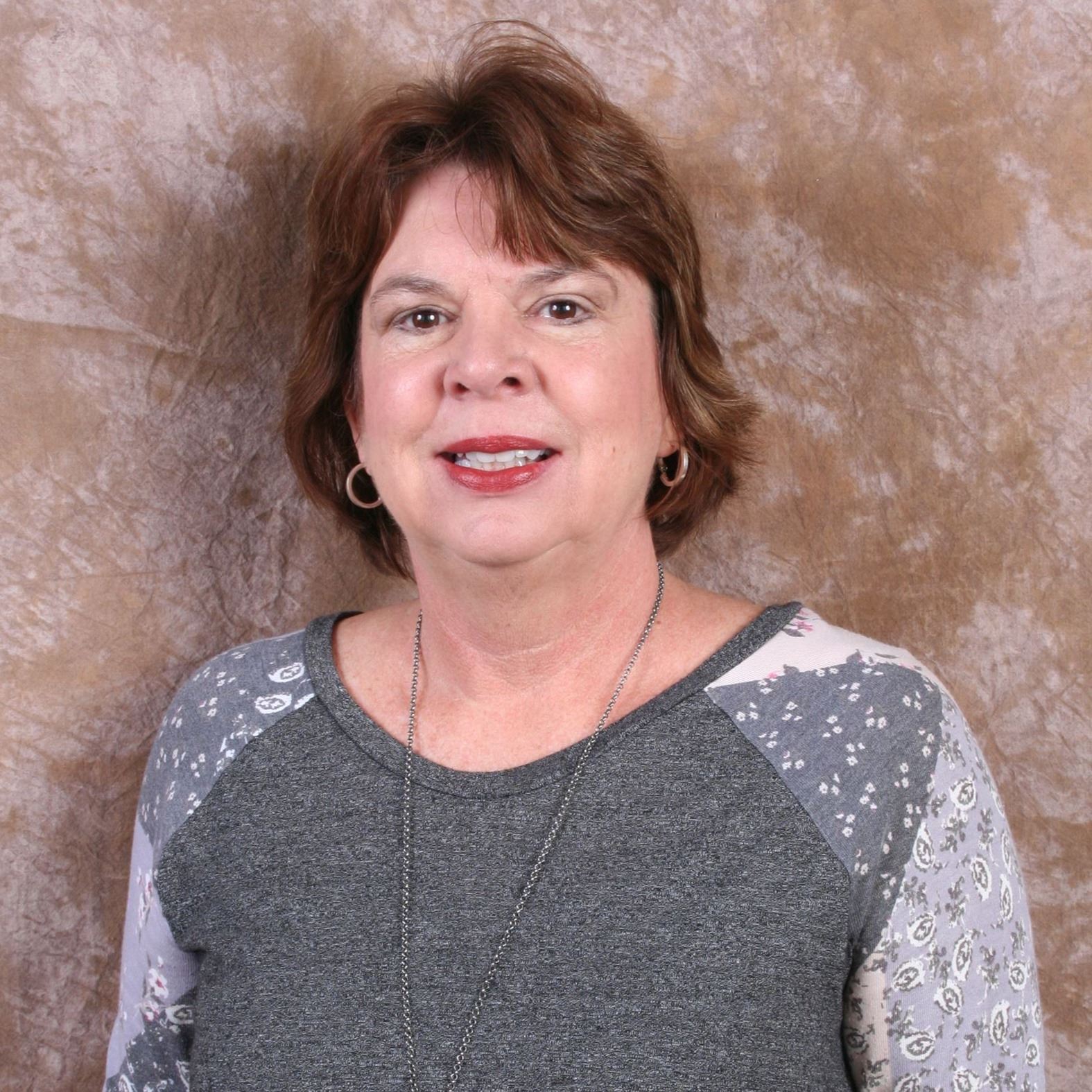 woman, smiling, sitting