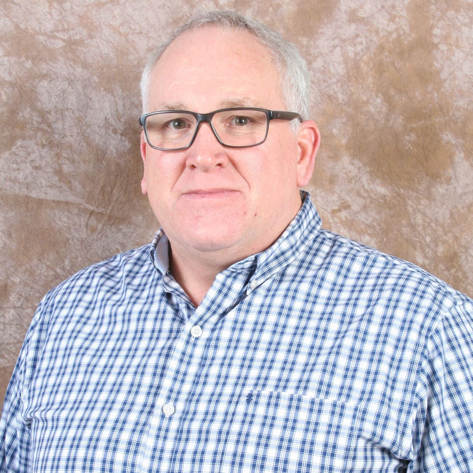 man sitting in button down shirt