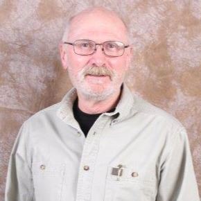 man in glasses with button up shirt